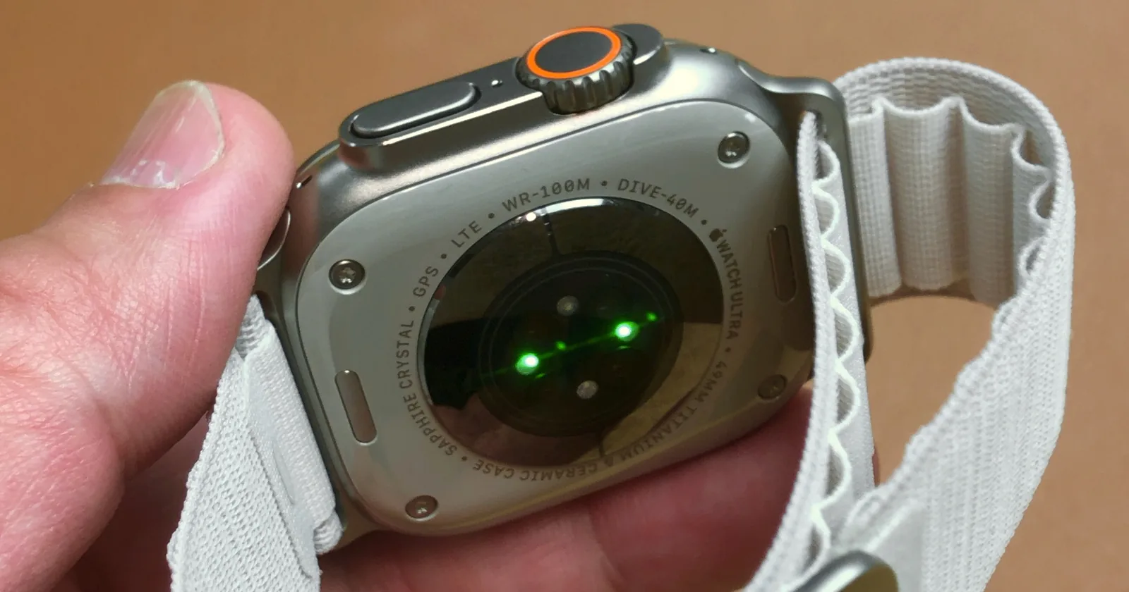 Case back of an Apple Watch Ultra engraved WR-100M and DIVE-40M, the 40 m dive rating of every Ultra