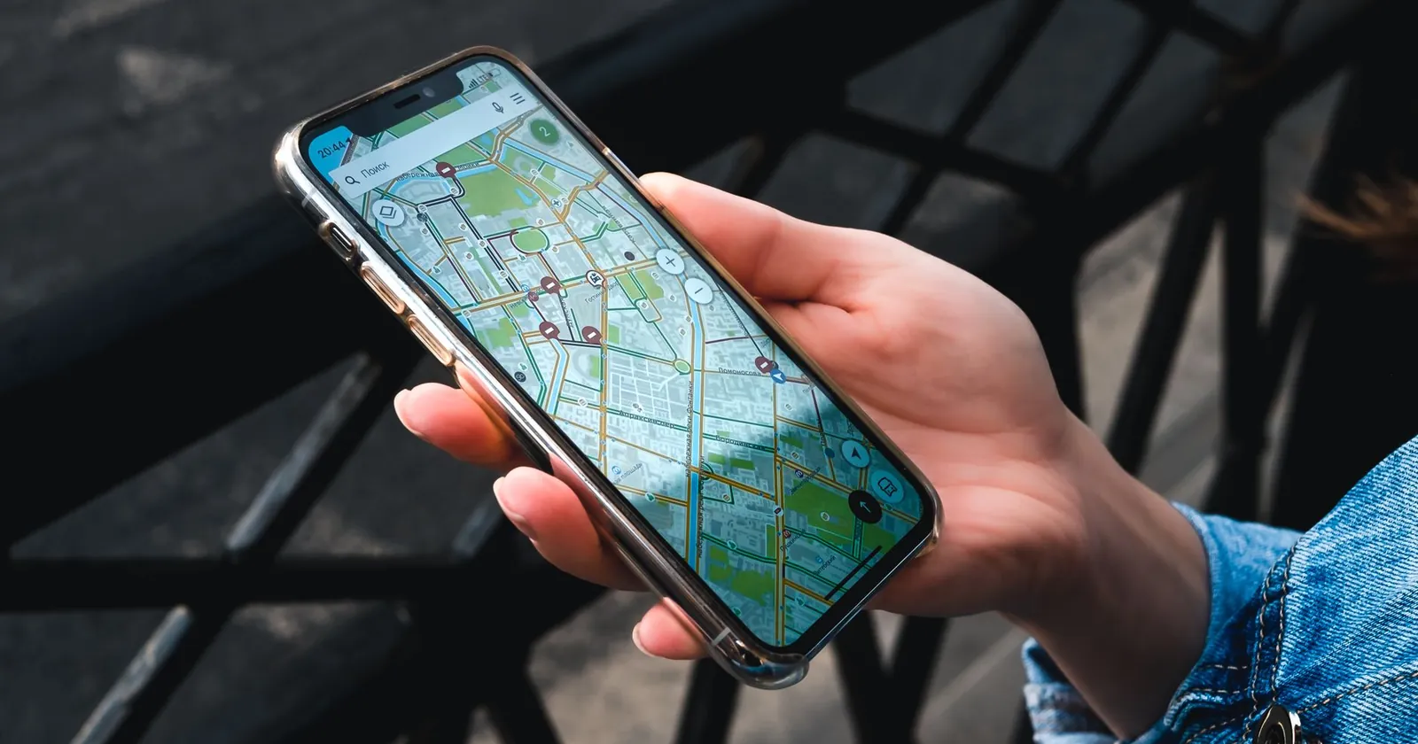 Digital nomad checking a phone on the road, staying connected with an eSIM