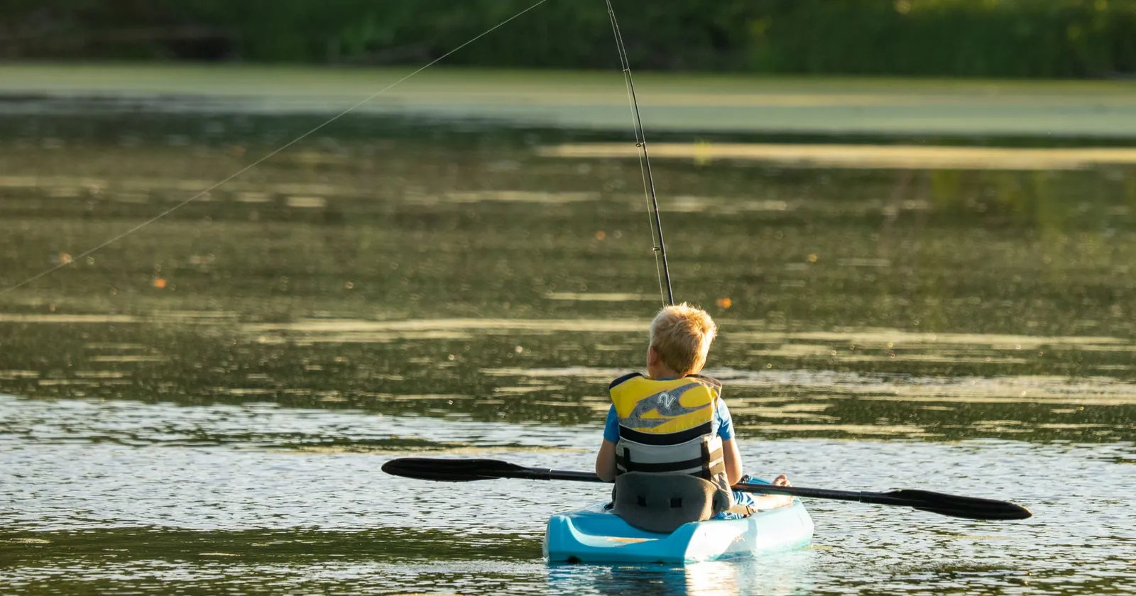 Stable sit-on-top fishing kayak rigged with rods