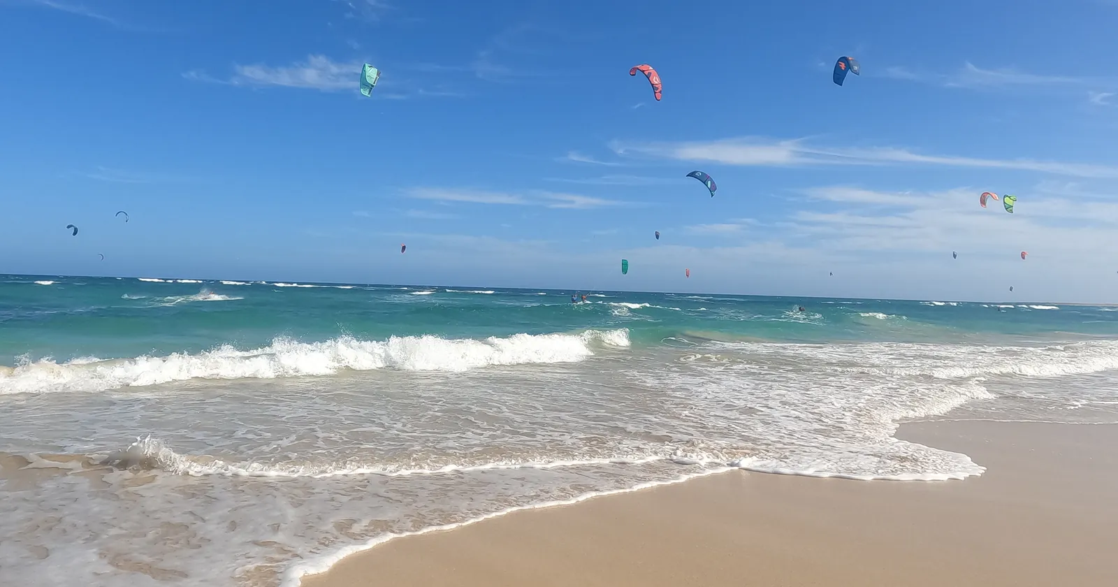 Kites over the surf at Kite Beach near Santa Maria on Sal, Cape Verde, in January