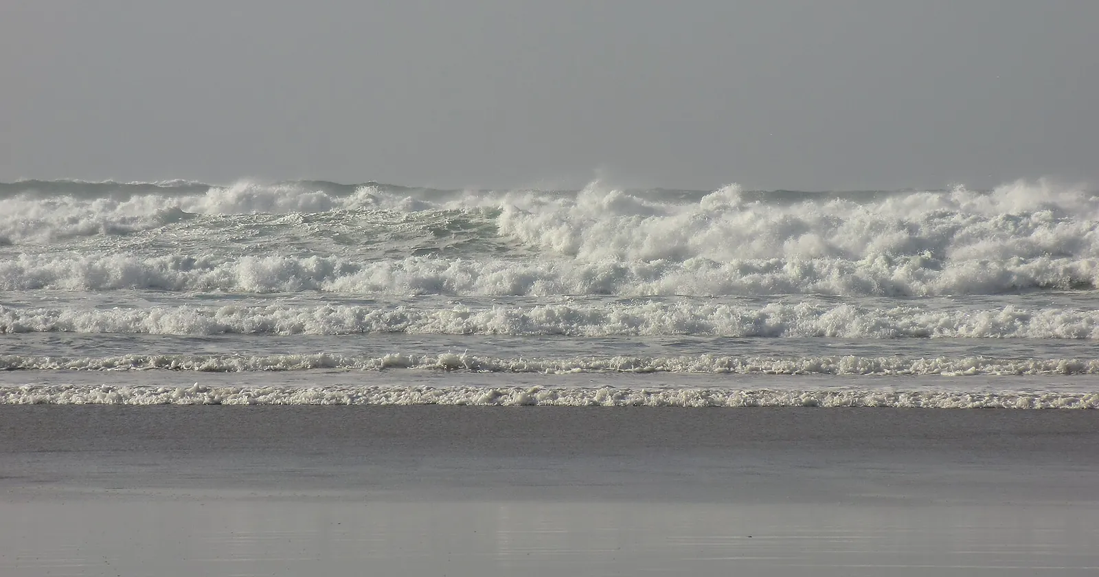 Rows of Atlantic breakers rolling onto Perranporth Beach on the north coast, the exposed side of Cornwall diving