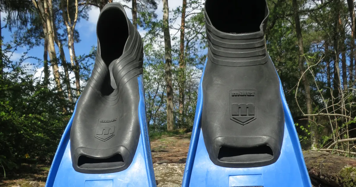 Foot pockets of a pair of Mares full-foot fins, the closed-heel design used for warm-water travel fins