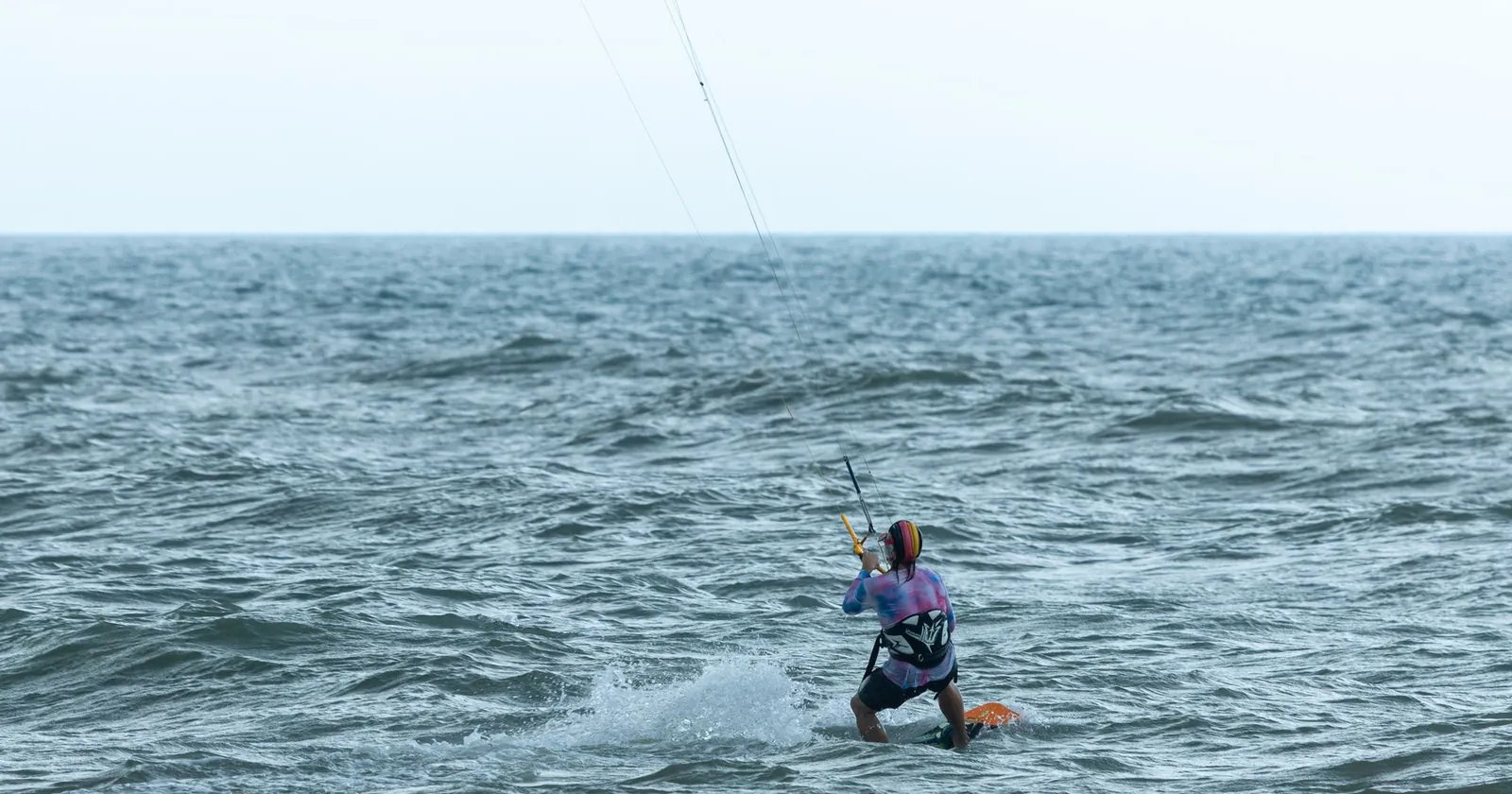Kitesurfers on a windy Brazilian beach, the kind of setting at Cumbuco