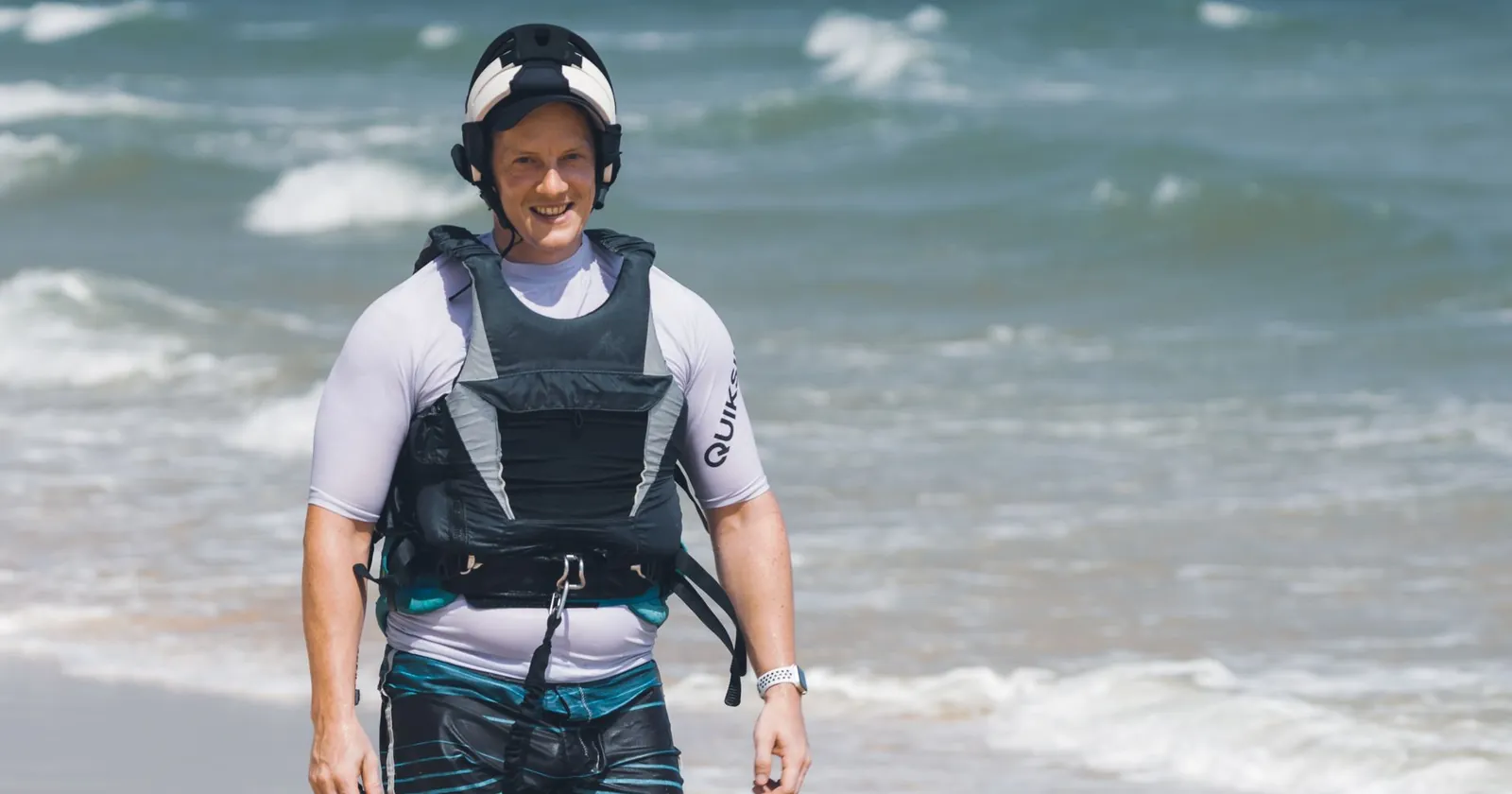 Foiler wearing a helmet and impact vest