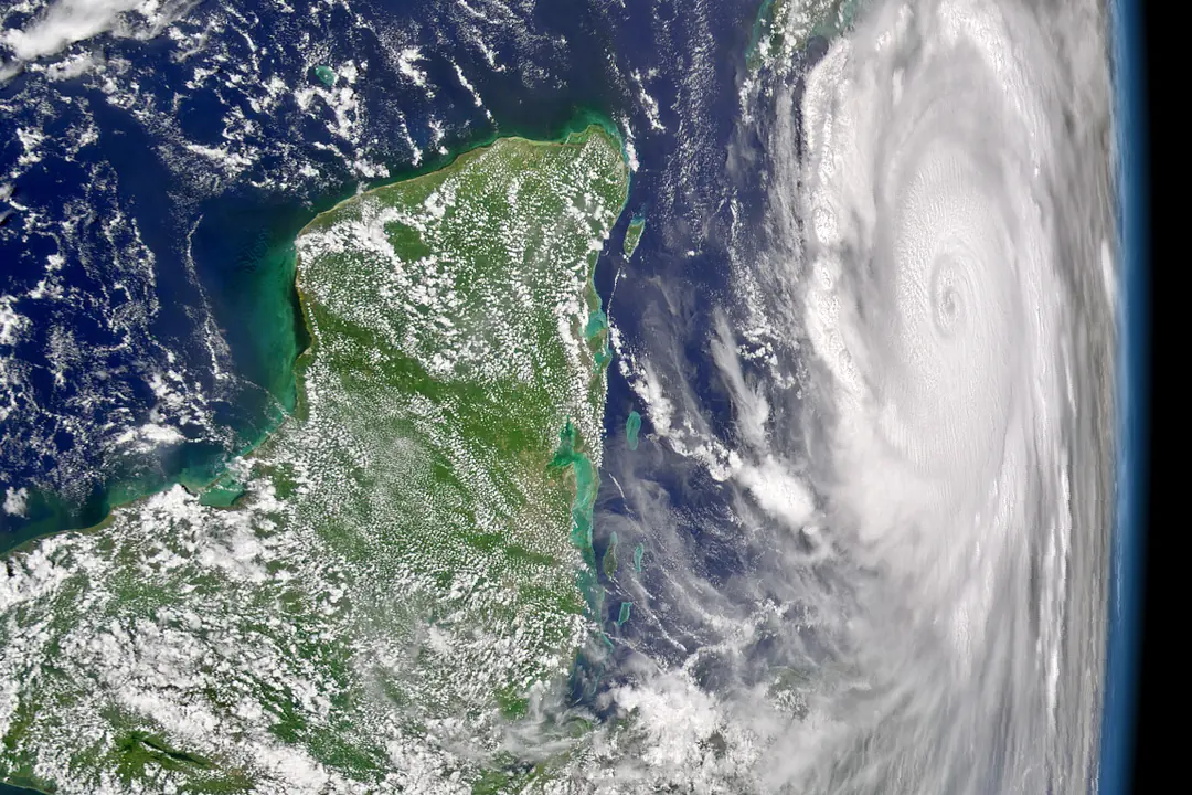 Satellite image of Hurricane Ivan on 12 September 2004, the day its center passed south of Grand Cayman, illustrating the hurricane season section of this Grand Cayman diving guide