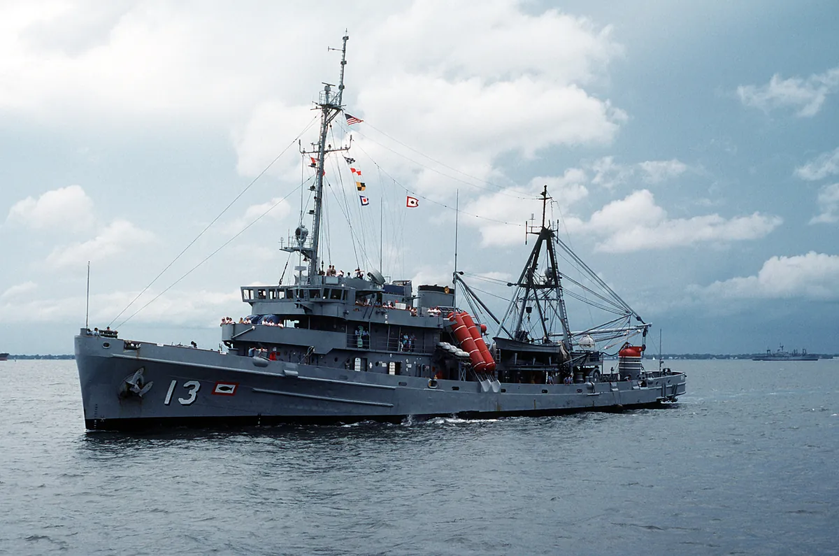 USS Kittiwake (ASR-13) underway in Hampton Roads in 1988, the submarine rescue ship later sunk as the Kittiwake wreck of Grand Cayman diving