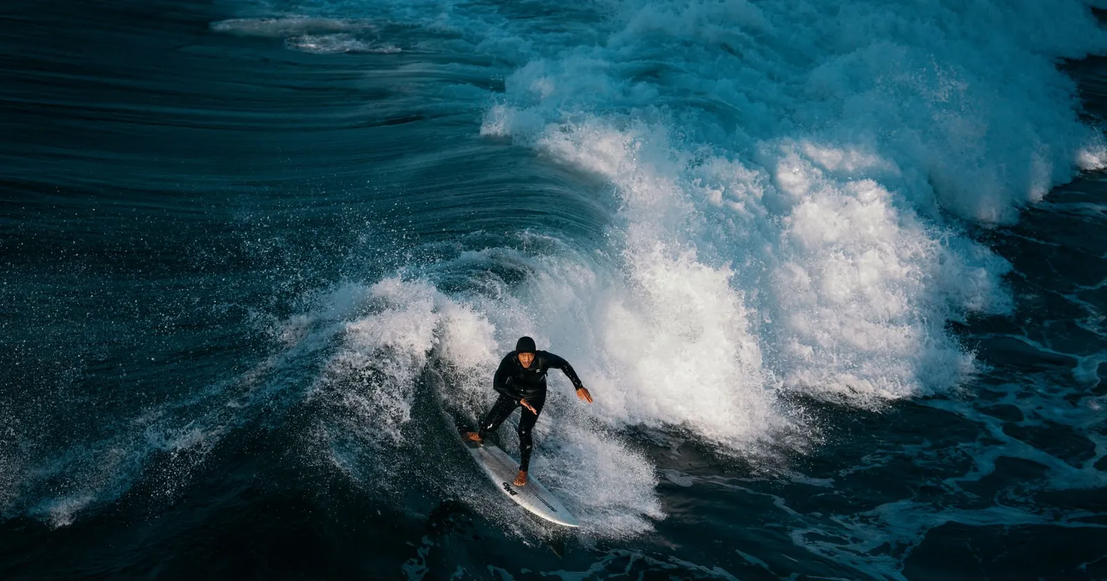 Bodysurfer riding a wave with swim fins