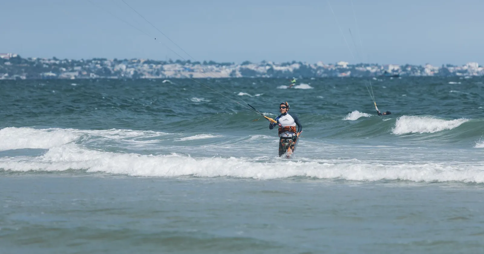 Rider powering across the water, a wind-powered watersport
