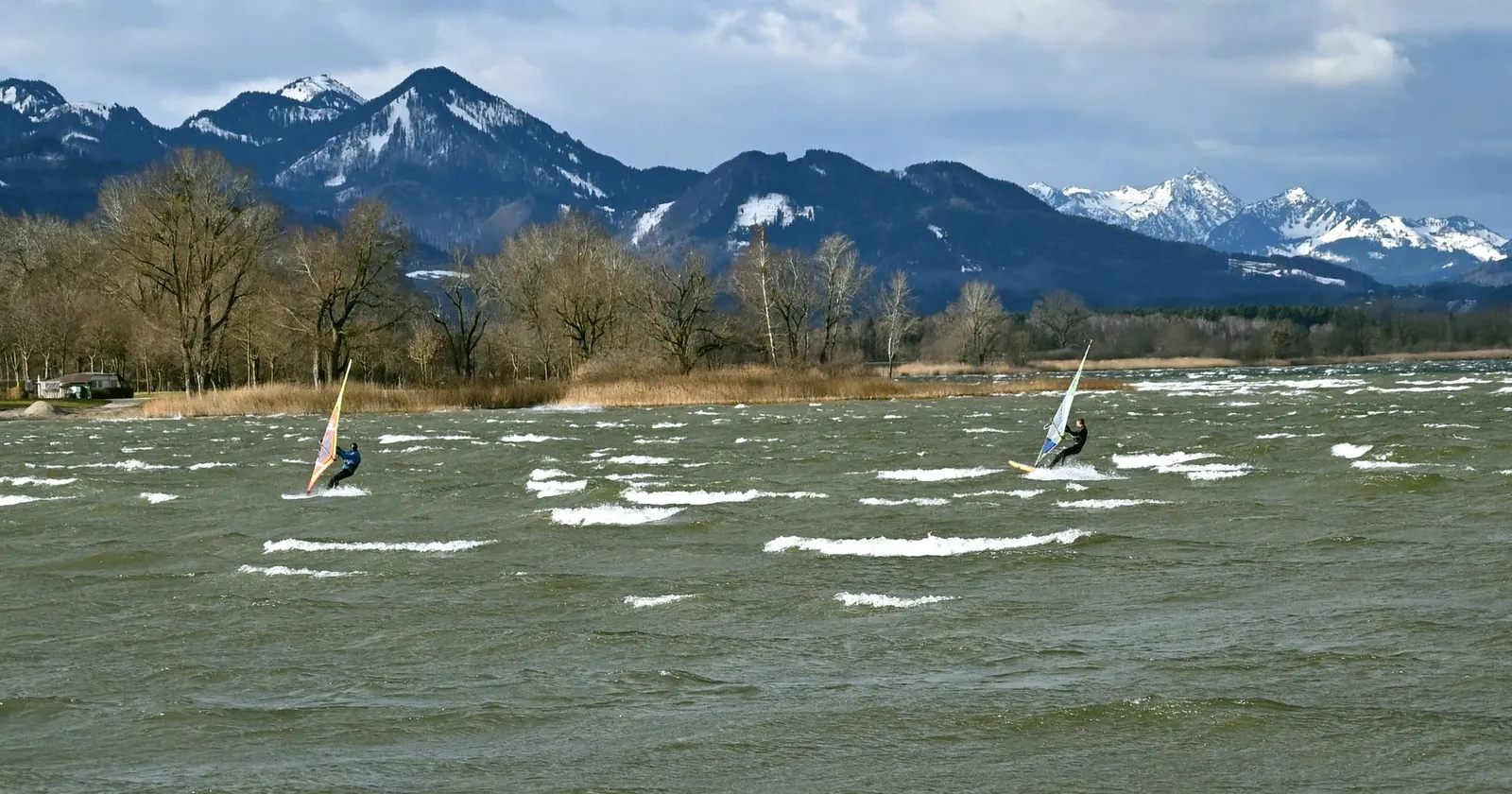 Beginner windsurfer finding balance on a big board