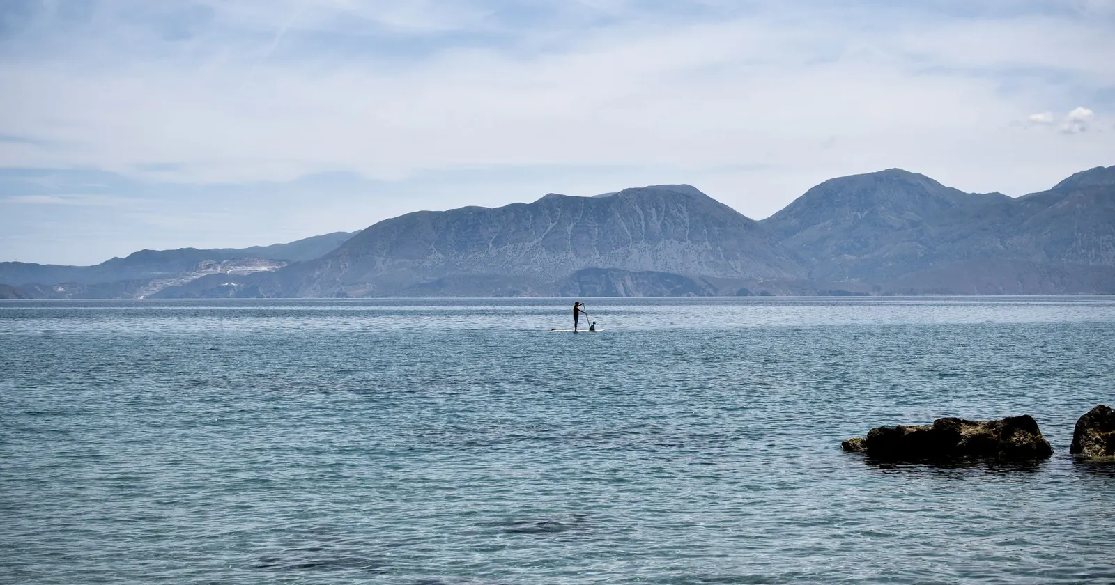 Stand-up paddleboard rigged for fishing with rod and tackle