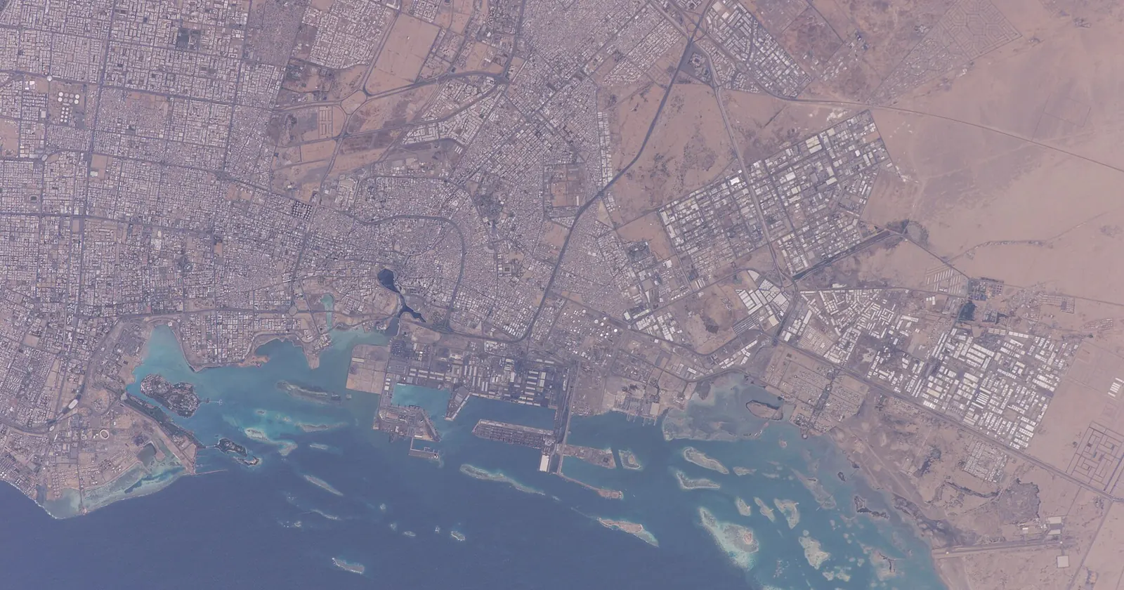 Jeddah diving shelf seen from the International Space Station: the city, the Islamic Port and the patch reefs on the shallow shelf in front of the coast