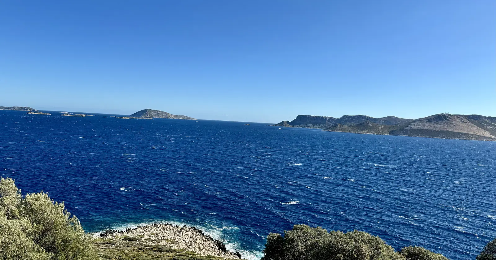 The open sea between Kaş and the Greek island of Meis, seen from Andifli in Kaş, with Meis on the right and small islets on the horizon, the water where most Kaş diving happens