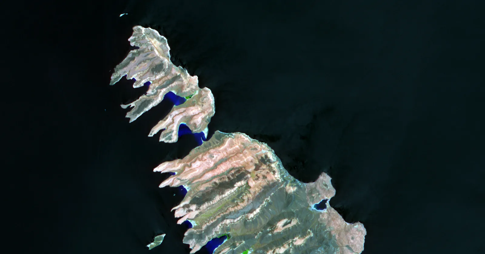 Isla Partida and the northern half of Isla Espíritu Santo from orbit, the islands whose surrounding sea is the national park for La Paz diving