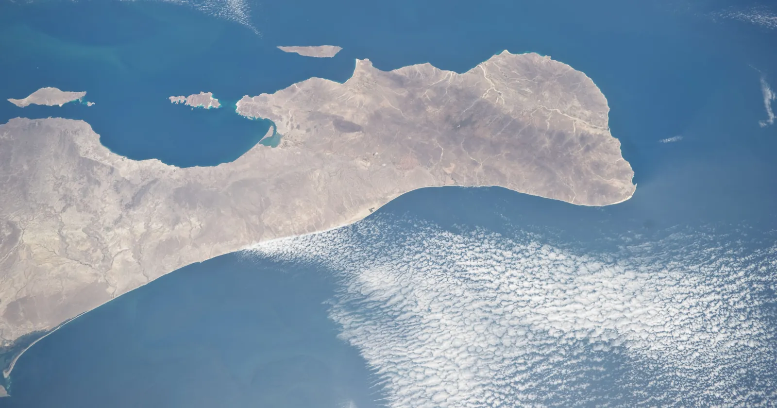 The southern tip of the Baja California peninsula seen from the International Space Station, with the Los Cabos cape where the Arch and Cabo Pulmo dive areas lie at the right-hand end