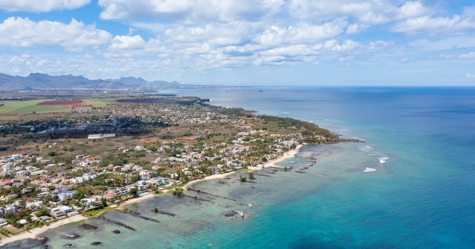 Aerial view of the Trou aux Biches coast in north-west Mauritius, with the reef flat and lagoon where two Mauritius diving centers are filed