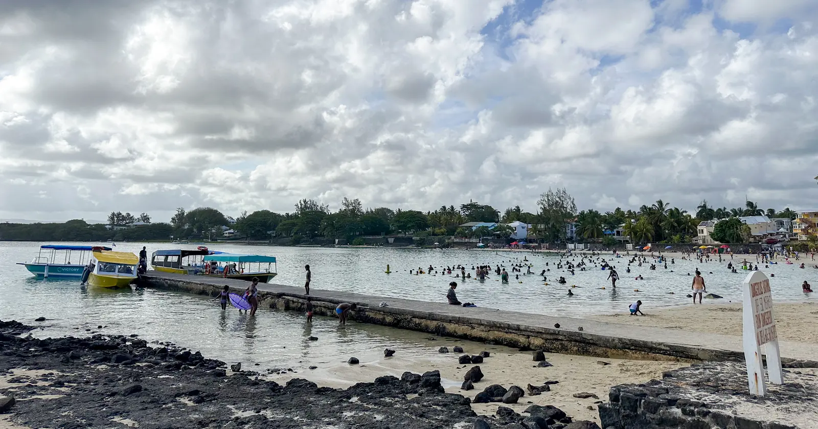 Tour boats at a jetty on the Blue Bay lagoon in south-east Mauritius, water of the Blue Bay Marine Park where Mauritius diving boats need a permit
