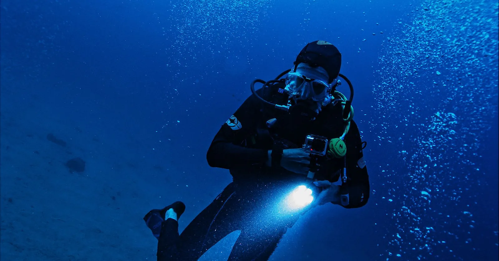 Diver with a torch on a night dive