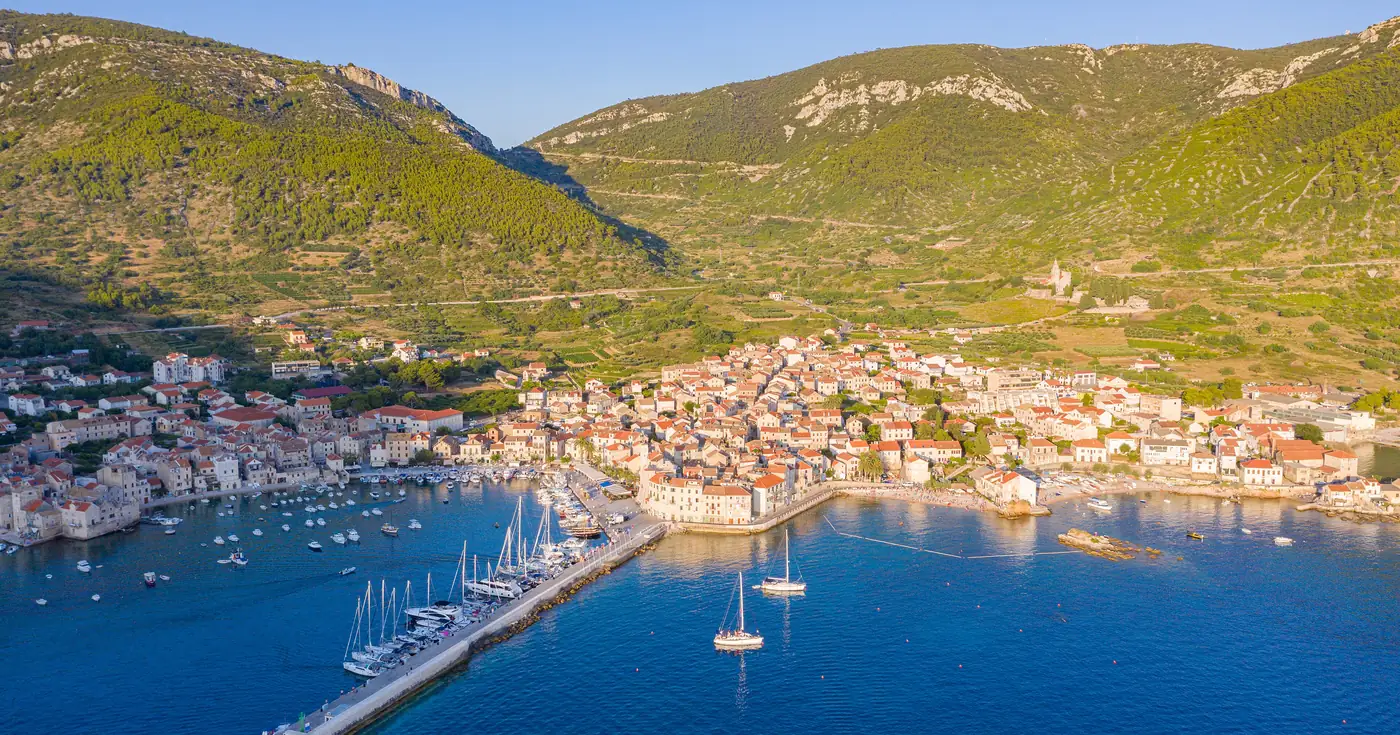 Aerial view of Komiza harbor on the island of Vis, the far end of Split diving trips to the protected wreck zone