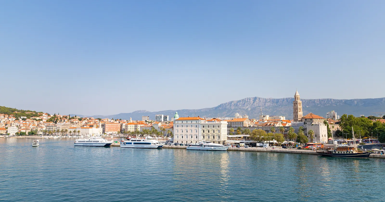 The Split waterfront seen from the ferry port, with Jadrolinija catamarans moored along the harbor where Split diving trips to Brac, Solta and Vis begin