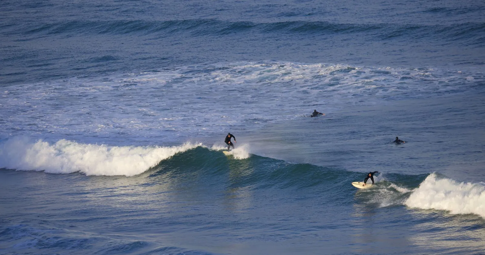 Surfer riding a powerful wave, respecting the lineup