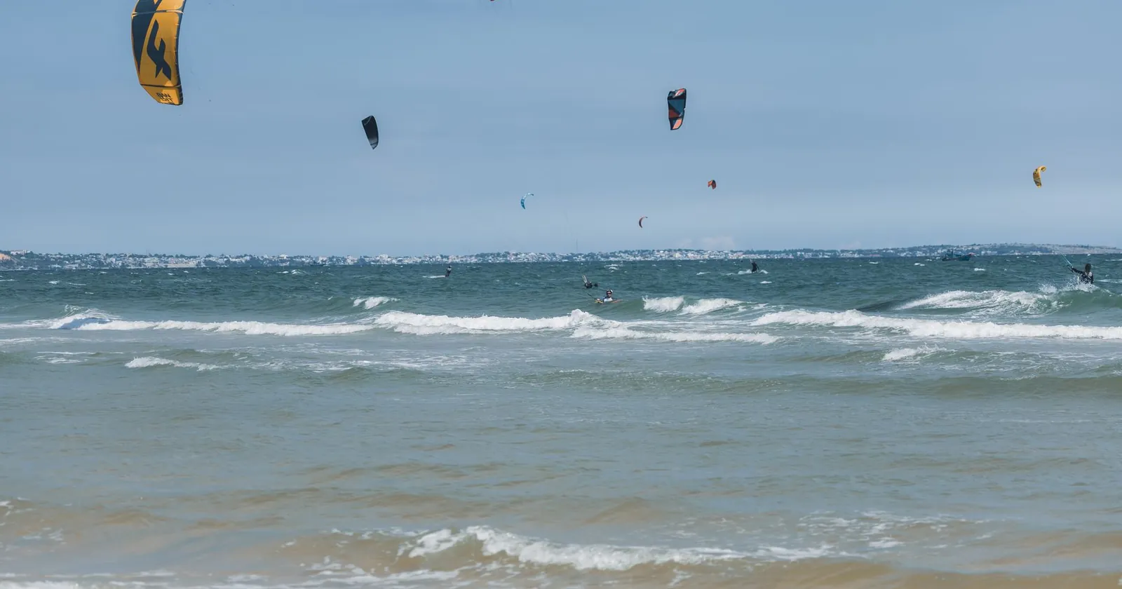 Windy coastline with watersports, the kind of setting at Tarifa