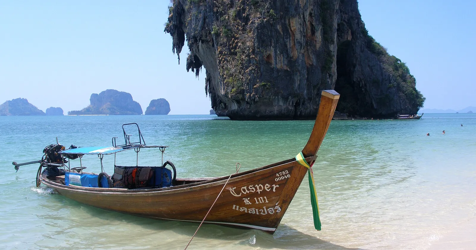 Longtail boat and limestone karst at Railay, Krabi, on Thailand's Andaman coast